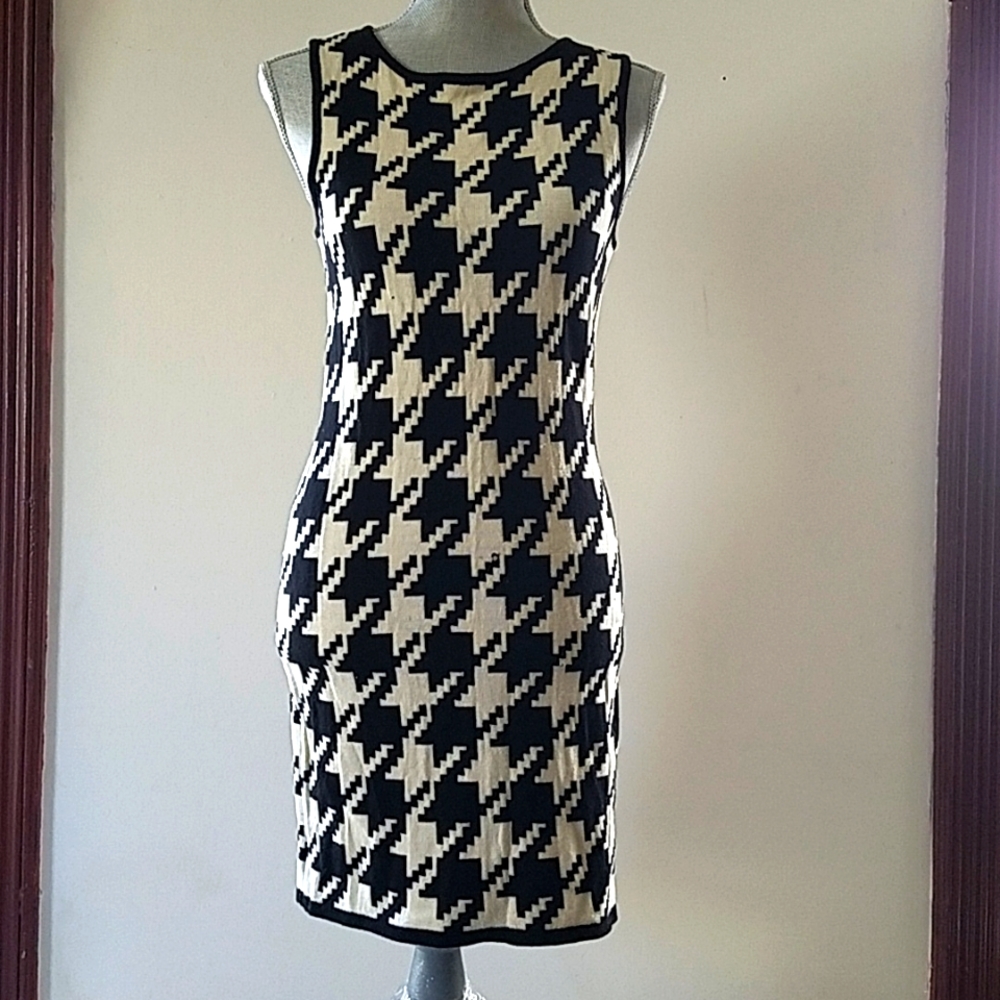 Calvin klein dress very stylis black and white have somes small holes.